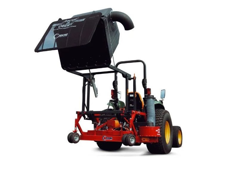 Red mounted farming implement with a black canopy and large rear wheels, used for field seeding behind a tractor (agricultural planter).