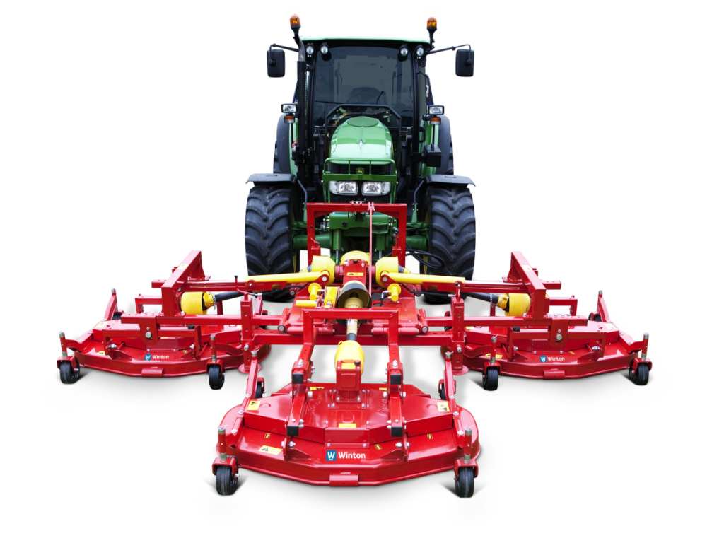 Green tractor pulling a large red multi-section mower attachment for cutting grass/silage.